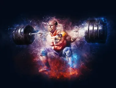 Muscular strong man exercise with weights in the gym.